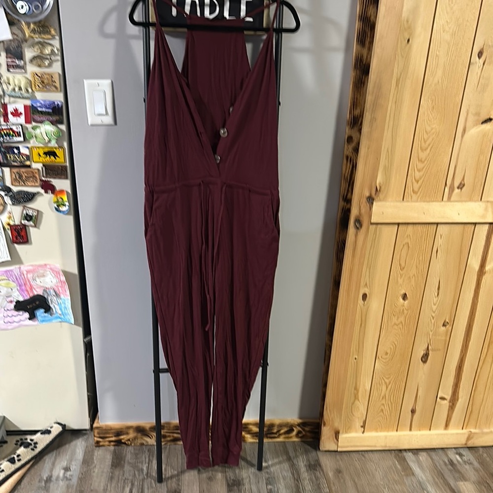 Elegant Red Jumpsuit with Plunging V-Neck and Sleeveless Design